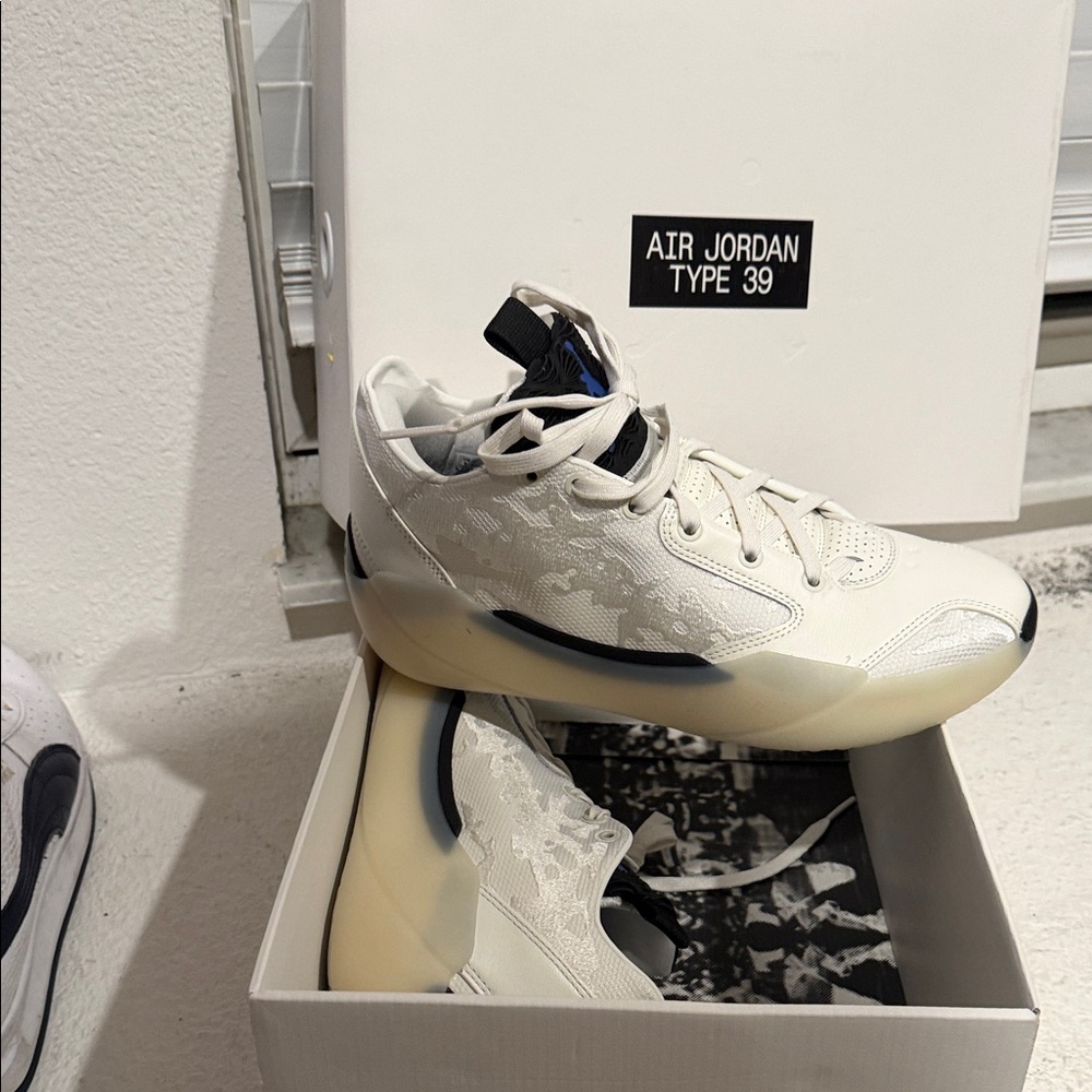 Jordan Type 39 White and Black Sneakers